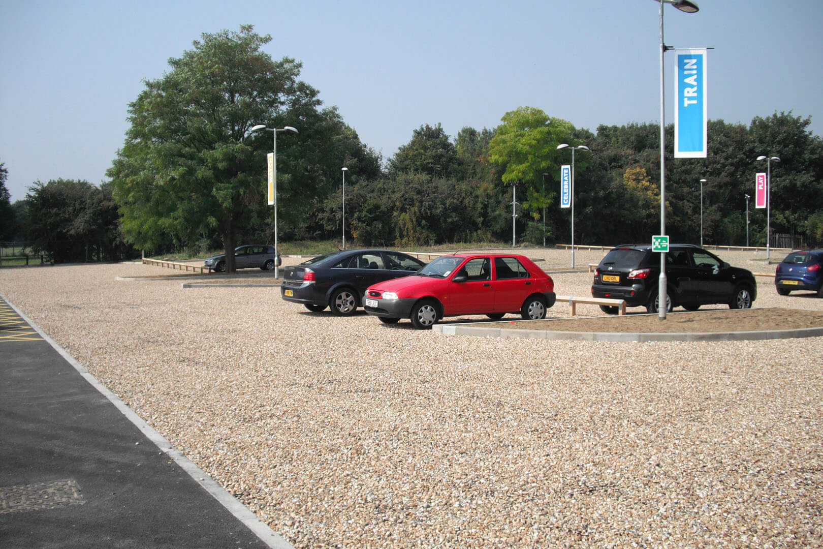 Gravel driveway with cars